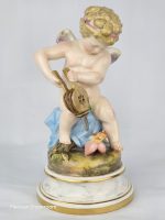 Meissen Cupid Fanning Hearts with Bellows